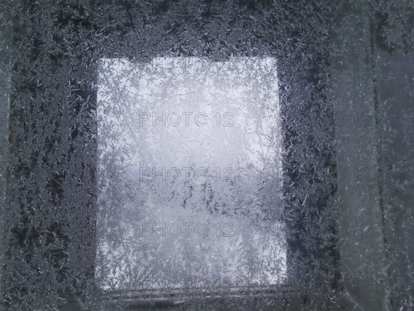 An icy window with frosty structures that give off a cold winter feeling, Franconian Forest nature