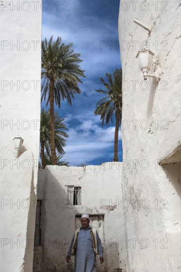 Ghadamis, Libya, North Africa. A bedouin walking through the whitewashed houses built traditionally