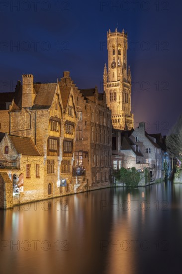 Bruges. Belgium. Flanders. Historic Houses and Town Hall tower in the old district overlooking a