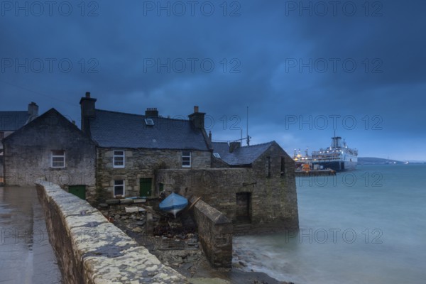 Lerwick, Shetland Islands, Scotland, UK. A traditional stone house at the sea near the port in