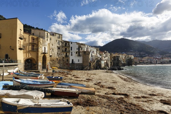 Traditional fishing boats on the shore, La Rocca mountain, Tyrrhenian Sea, Cefalu, Cefalù, Sicily,