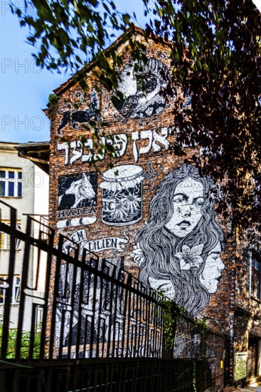 Street art on the wall of a building in the Kazimierz Jewish Quarter, a historically significant,