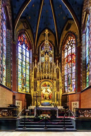 Wyspianski stained glass window and main altar in the presbytery, Franciscan Church, 1249, Krakow,
