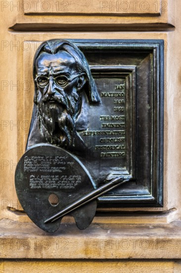 Memorial plaque for the famous Polish painter Matejko, details of the old town alleys, Krakow,