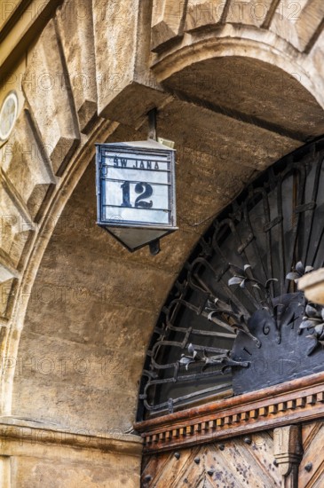 Typical house number lanterns, details of old town lanes, Krakow, Poland