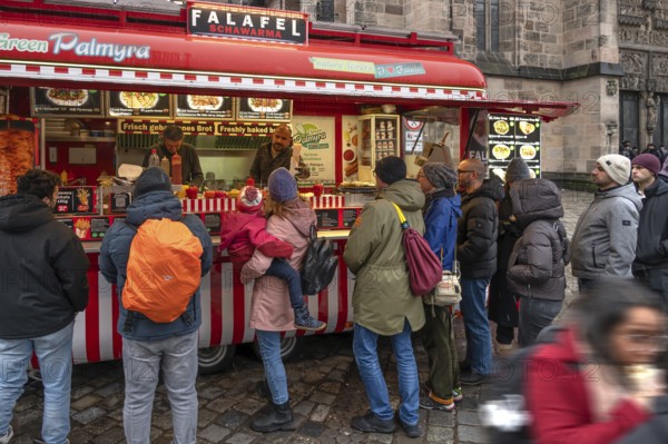 People waiting at the falafel stand in front of St. Lorenz Church, Nuremberg, Middle Franconia,