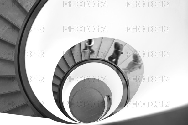 People walking downhill on a spiral staircase, movement, black and white, Nuremberg, Middle