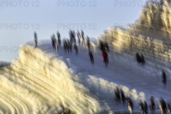 Terraced chalk cliffs Scala dei Turchi, anonymous walkers on Turkish steps, illustration, motion
