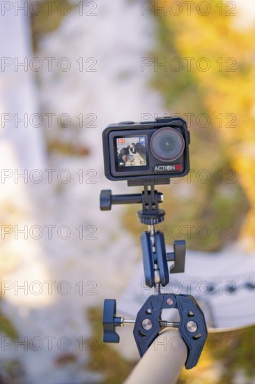 An action camera on a stand in a wintery outdoor environment, fiberglass groundbreaking,
