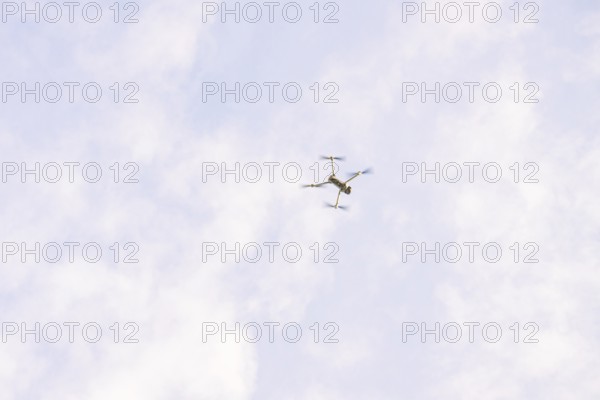 Drone in the sky with scattered clouds as it flies, fiberglass groundbreaking, Freudenstadt,