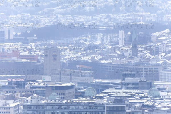 March 18, 2018, winter view with snow toward city center with station and tower from Mount