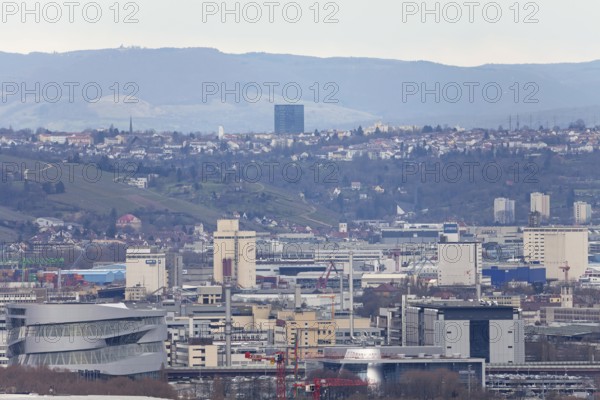 30.03.2018: Zoomed view of city roofs, towers and industrial buildings. Stuttgart,