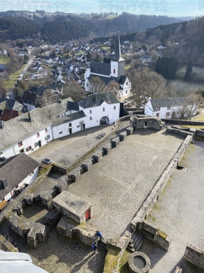View of preserved keep made of quarry masonry castle tower on castle ruins Burghof restored