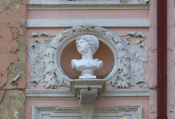 Bust of a woman on a dilapidated 19th century house façade, Czernowicz, Ukraine