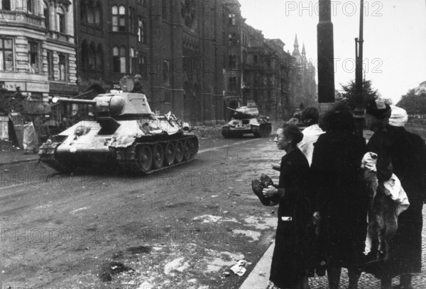 Soviet tanks at the Mehringdamm subway station, Landwehrkanal, civilians on the side of the road,