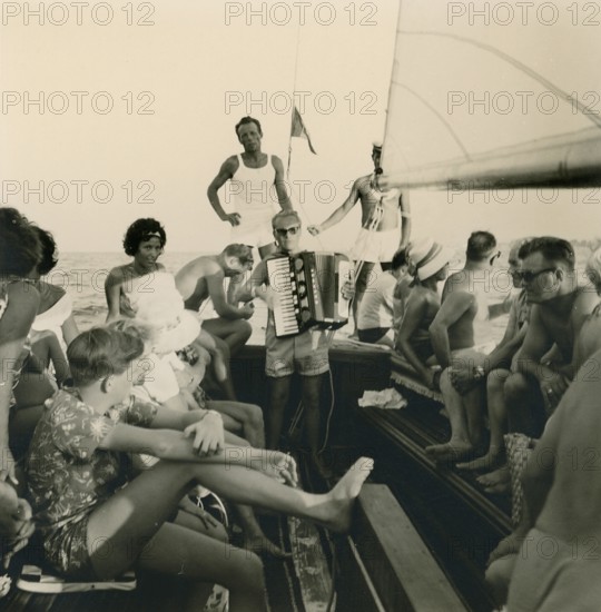 Historical photo summer 1961, tourists, beach, Rimini, Italy