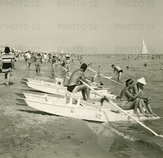Historical photo summer 1961, tourists, beach, Rimini, Italy