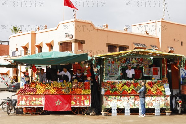 Stalls selling freshly squeezed fruit juices and smoothies on the Djemaa el Fna juggler square,