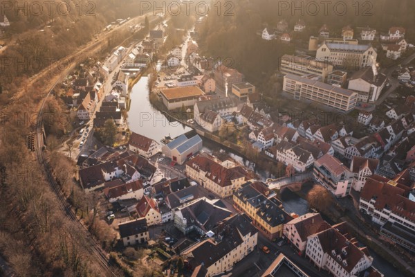 City view with river and buildings in sunlight from a bird's eye view, measurement trip on the new