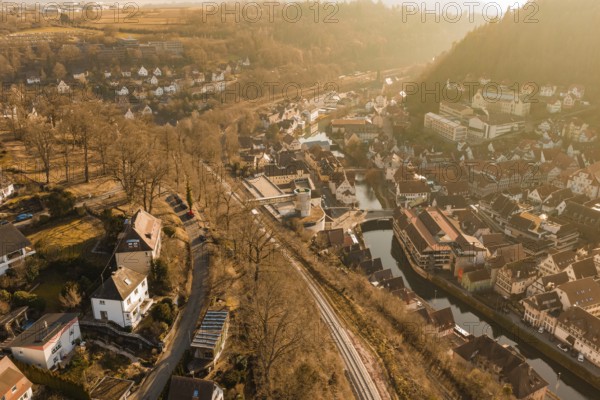 Small river town with train tracks and autumn tree scenery, test trip on the new Hermann-Hesse
