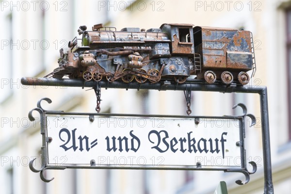 Advertising sign with a model of a steam locomotive for purchase and sale, Chemnitz, Saxony,