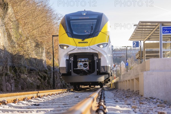Modern train viewed from the front, under bright sunshine, test run on the new Hermann-Hesse