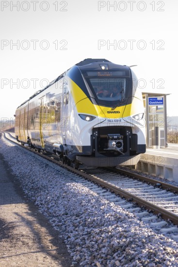 Train on platform in sunny weather, monorail shot, test run on the new Hermann-Hesse railway with