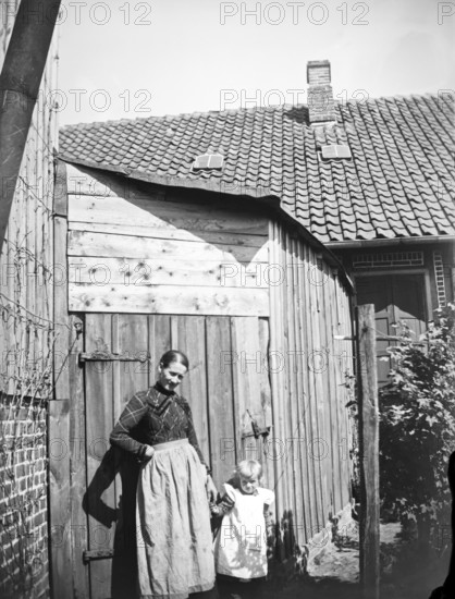 Woman and little girl posing for photo, ca. 1920-1930, retro, vintage, old, historic, northern