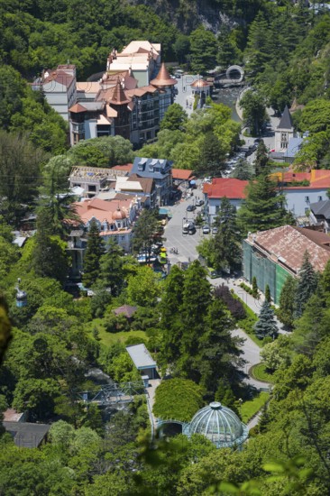 Bird's-eye view of the city with buildings and dense forests and green areas, Borjomi, Borjomi,