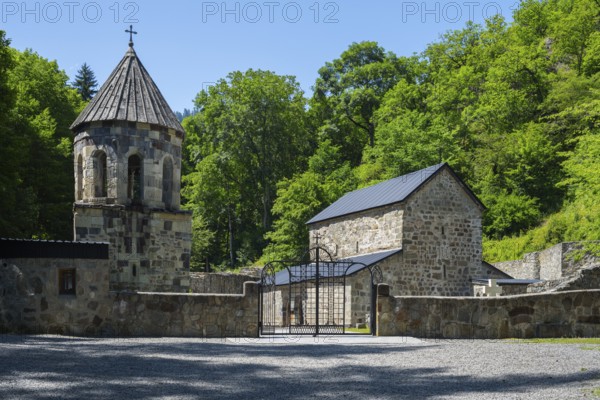 Church complex with stone structures and an open gate, Chitakhevi Church of St. George, The Green