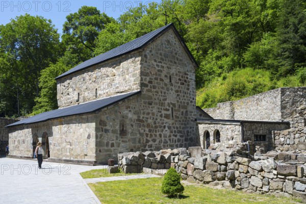 Historic stone church with trees in the background and a footpath, Chitakhevi Church of St. George,