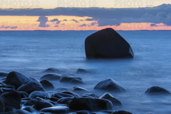 Evening on the chalk coast in Jasmund National Park, rocks in the Baltic Sea, Rügen, Lohme,