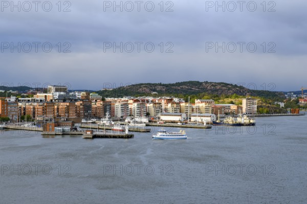 Panorama of a harbor with municipal buildings and cloudy sky in the background in Gothenburg, Stena