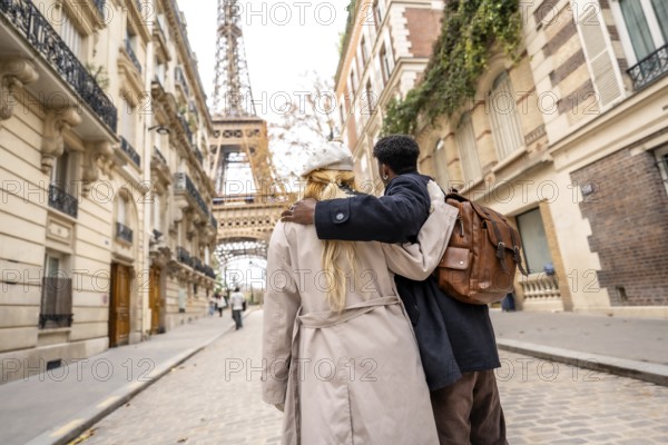 Diverse couple embracing in a romantic moment, walking through a charming parisian street with