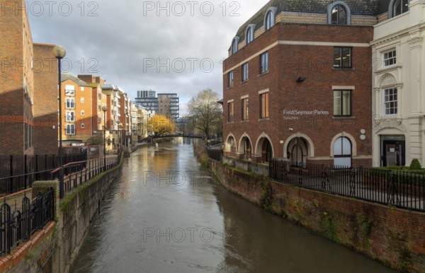 River Kennet flowing past apartment housing and businesses, view east from London Street, Reading,