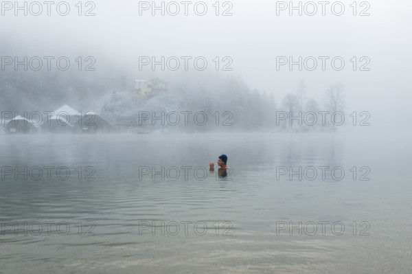 Man with cap, 55, ice bathing, including winter bathing in Königssee, Schönau am Königssee,