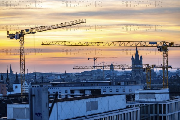 View of downtown Cologne, construction cranes from various construction sites, tower of Groß St.