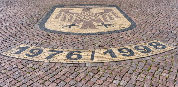 Brandenburg coat of arms on paving stone, sidewalk in front of the Brandenburg Gate in Potsdam,