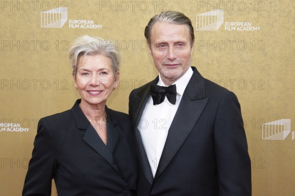 Mads Mikkelsen with woman Hanne Jacobsen, EUROPEAN FILM AWARDS Berlin 2026, photo call at the House
