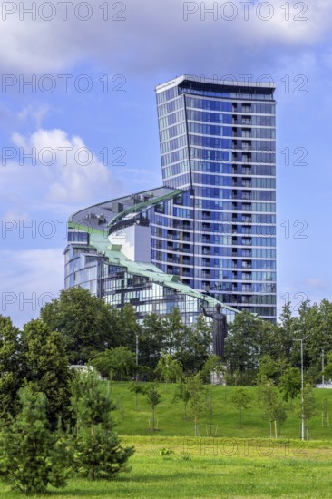 Sculpture First Swallows, Pirmosios kregzdes in front of the ARFA Tower, high-rise residential