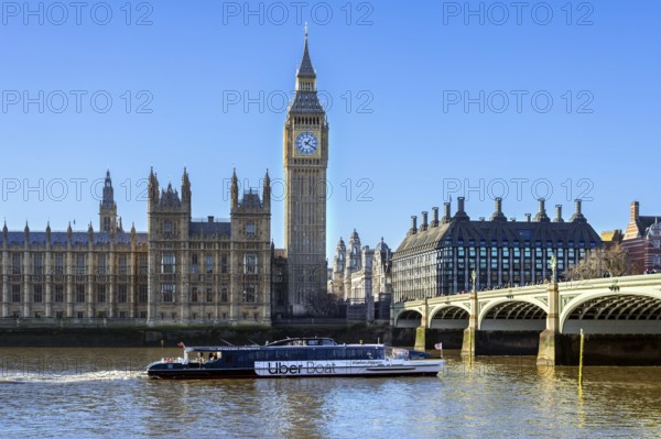 Uber Boat river bus by Thames Clippers on River Thames, Westminster Bridge, Elizabeth Tower, Big
