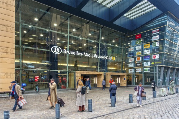 Entrance and travelers, commuters, tourists leaving the NMBS Brussels-South railway station, Gare