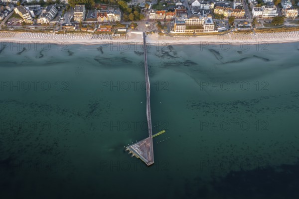 Aerial view over Seebrücke, pier and sandy beach at seaside resort Scharbeutz along the Baltic Sea,