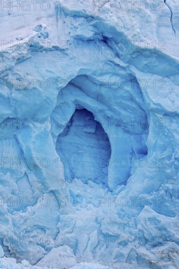 Blue ice wall of Monacobreen, glacier in Haakon VII Land which debouches into Liefdefjorden,