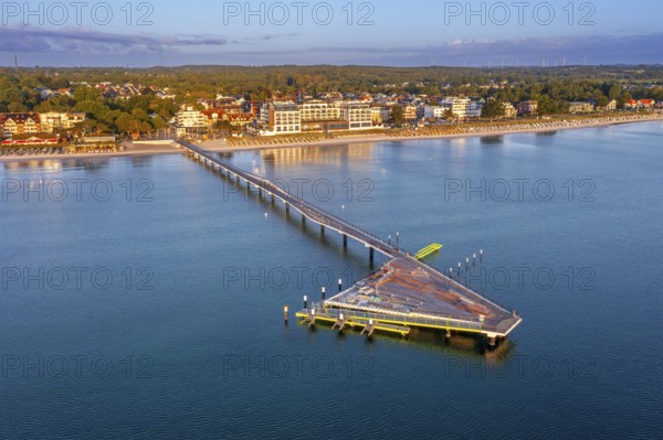 Aerial view over Seebrücke / pier and sandy beach at seaside resort Scharbeutz along the Baltic