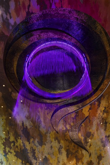 Artificial, brightly lit waterfall, Magic Waterfall, falls from the ceiling of the Iconsiam