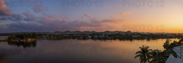 Scenic sunsets and colourful colonial architecture of historic center of Flores, Guatemala. View of
