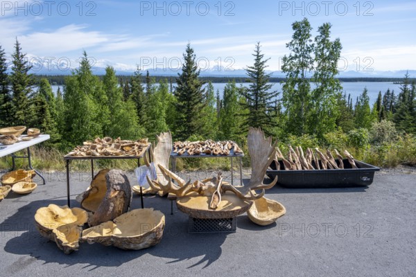 Sales stand for souvenirs with elk antlers and wood carving, Alaska, USA