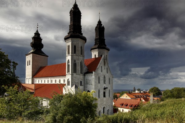 The distinctive cathedral rises under a dramatic sky in the old town, Visby, Gotland, Sweden