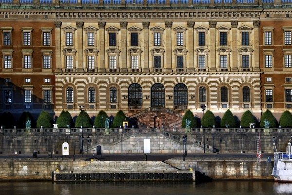 Stockholm's Royal Palace is majestically perched on the water with a detailed façade, Stockholm,